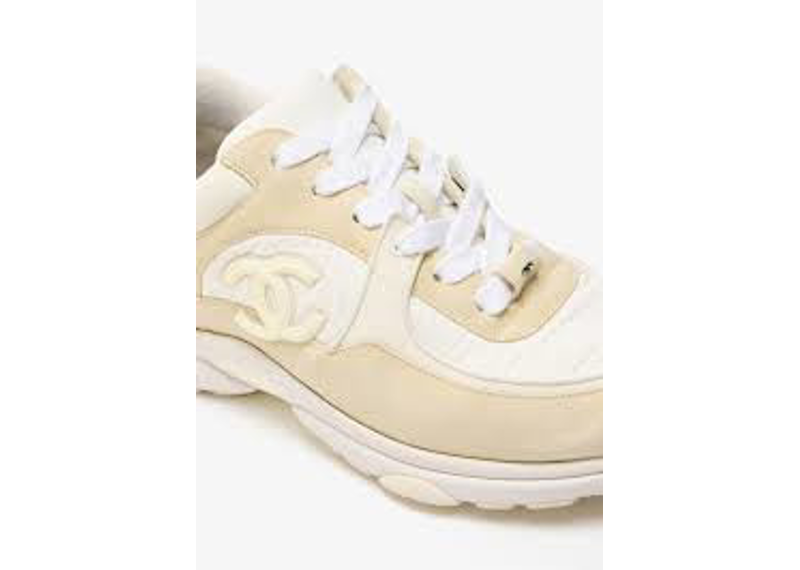 Chanel CC logo sneakers are crafted from white calfskin leather and suede