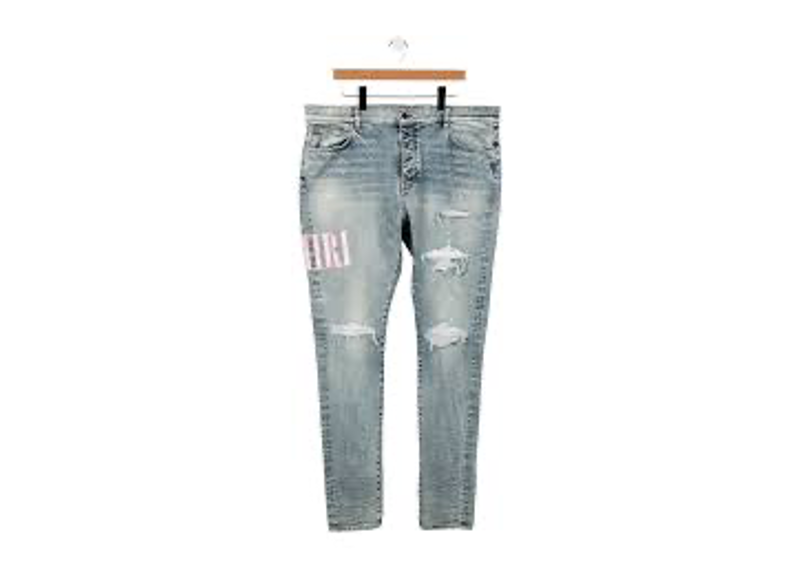 Amiri Stone Indigo Tie-Dye Core Applique Logo jeans feature ripped denim with pink tie-dye panels