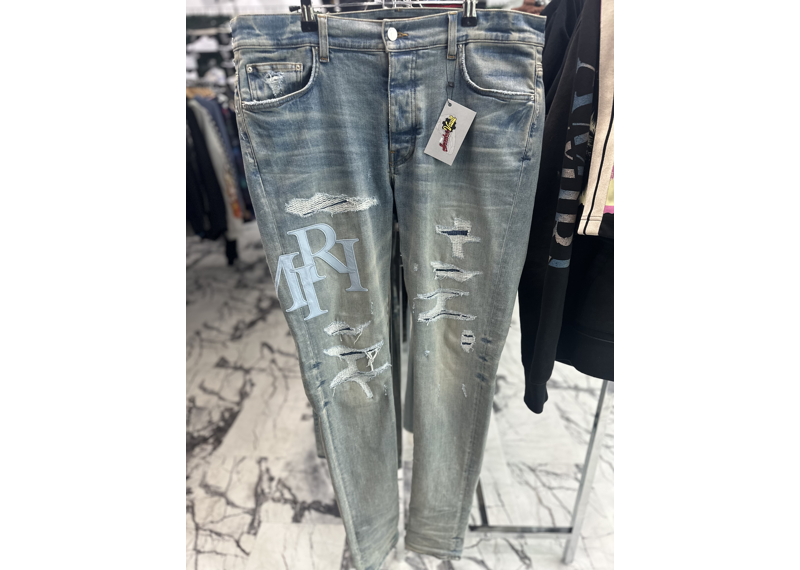 AMIRI staggered-logo skinny jeans