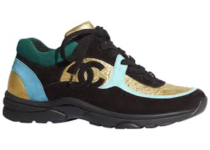 Chanel FW19 sneakers feature a distinct combination of black suede, blue accents, and metallic gold foil on the toe box.