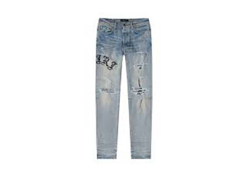Amiri Skinny Old English Logo Jeans in a light-washed Clay Indigo colorway.