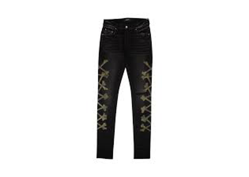 black Amiri bones applique skinny jeans.