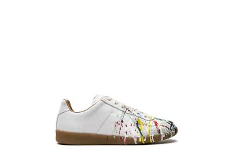 Maison Margiela Replica Paint low-top sneakers in white with a multicolored paint splatter effect.