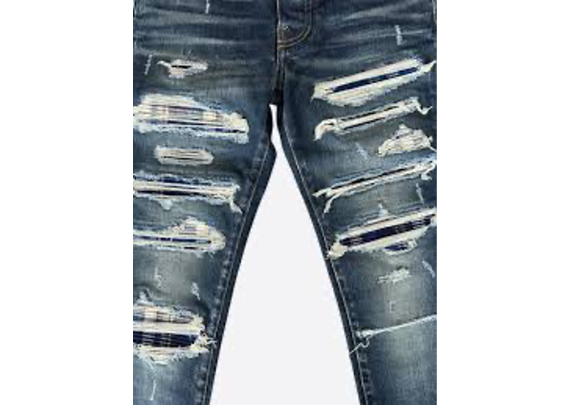 Amiri Blue Plaid MX1 Skinny Jeans feature heavy distressing and blue tartan patches.