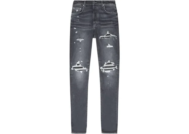 distressed AMIRI Thrasher Plus Jeans featuring an aged wash with prominent knee rips