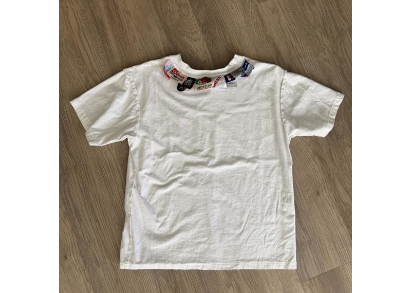 Greedy unit tag tee