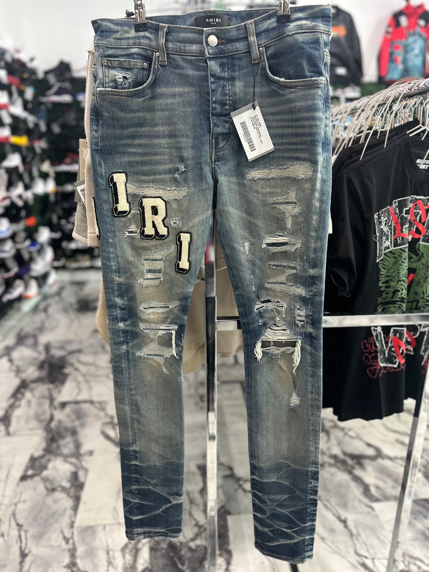 Amiri varsity ripped jeans
