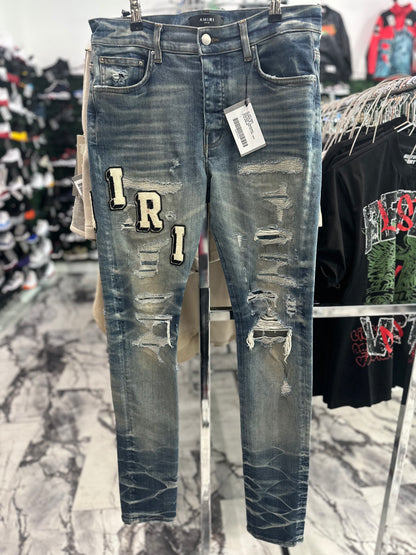 Amiri varsity ripped jeans