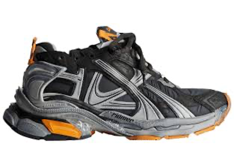 Balenciaga Runner sneakers in a worn-out black and fluo orange colorway.