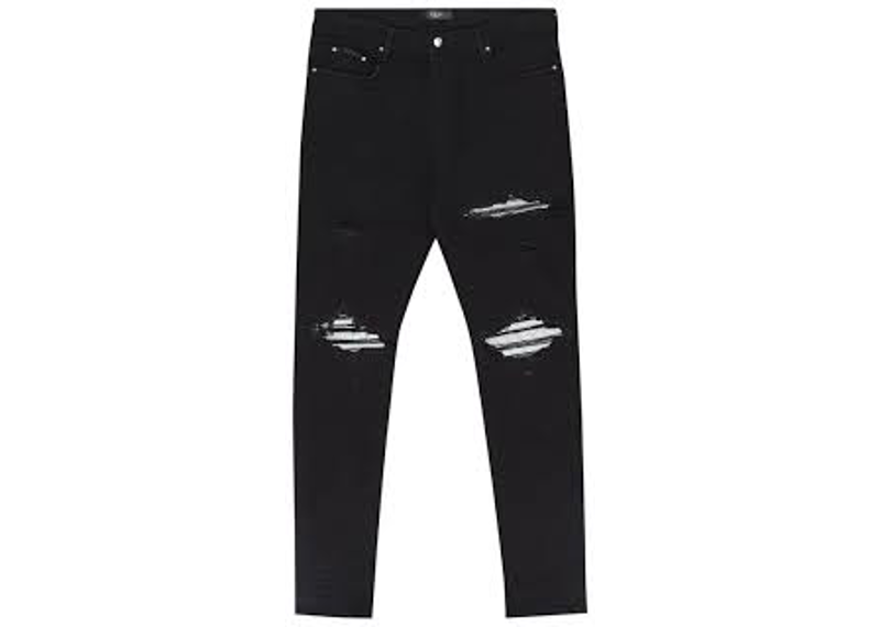 black Amiri MX1 distressed denim skinny jeans with ribbed silver knee patches.